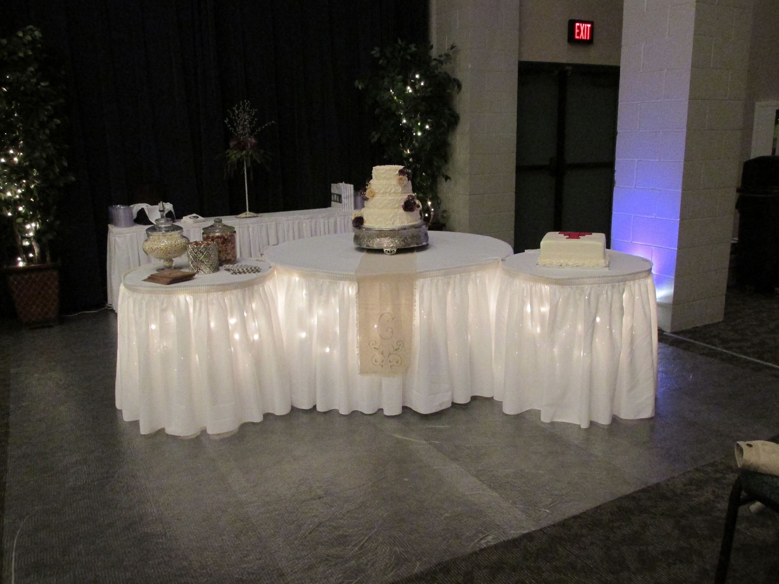 Wedding reception lighted cake table